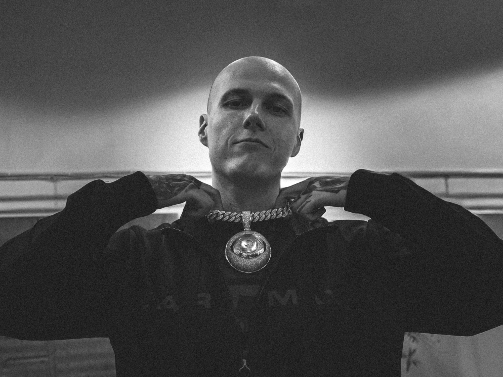 street portrait photography by Łukasz Zając, documentary black and white capture of rapper, Poland