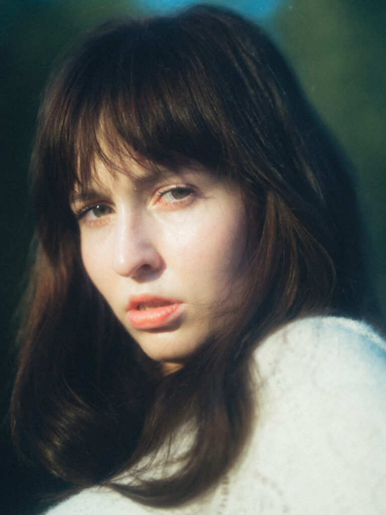 Editorial portrait photography by Łukasz Zając, soft natural light profile portrait of a woman, Krakow, Poland