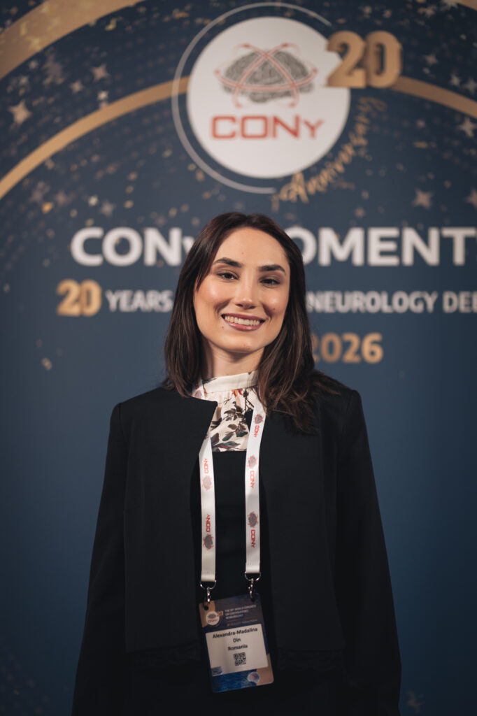Event and conference photography by Łukasz Zając, portrait of a woman wearing a lanyard against a branded backdrop at the CONV 2026 conference, Kraków, Poland