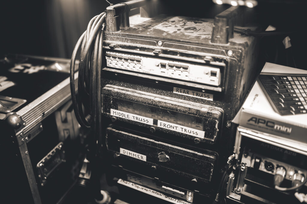 Culture and events backstage photography by Łukasz Zając, audio equipment rack and cables backstage in black and white, Kraków, Poland